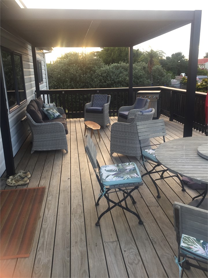 Sheltered louvered roof over deck