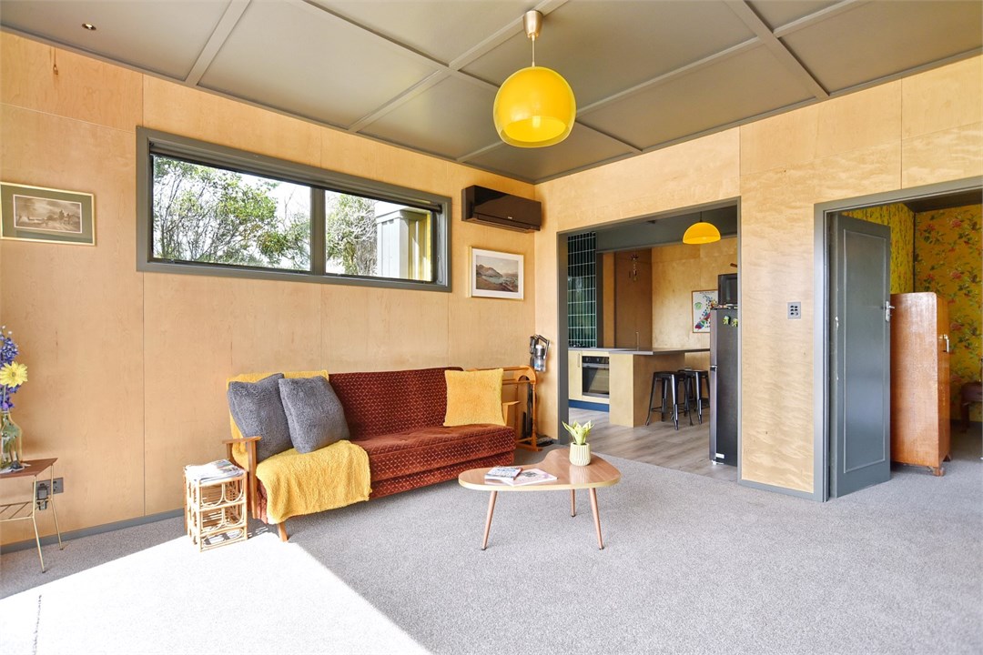 Living room with seating areas and a TV