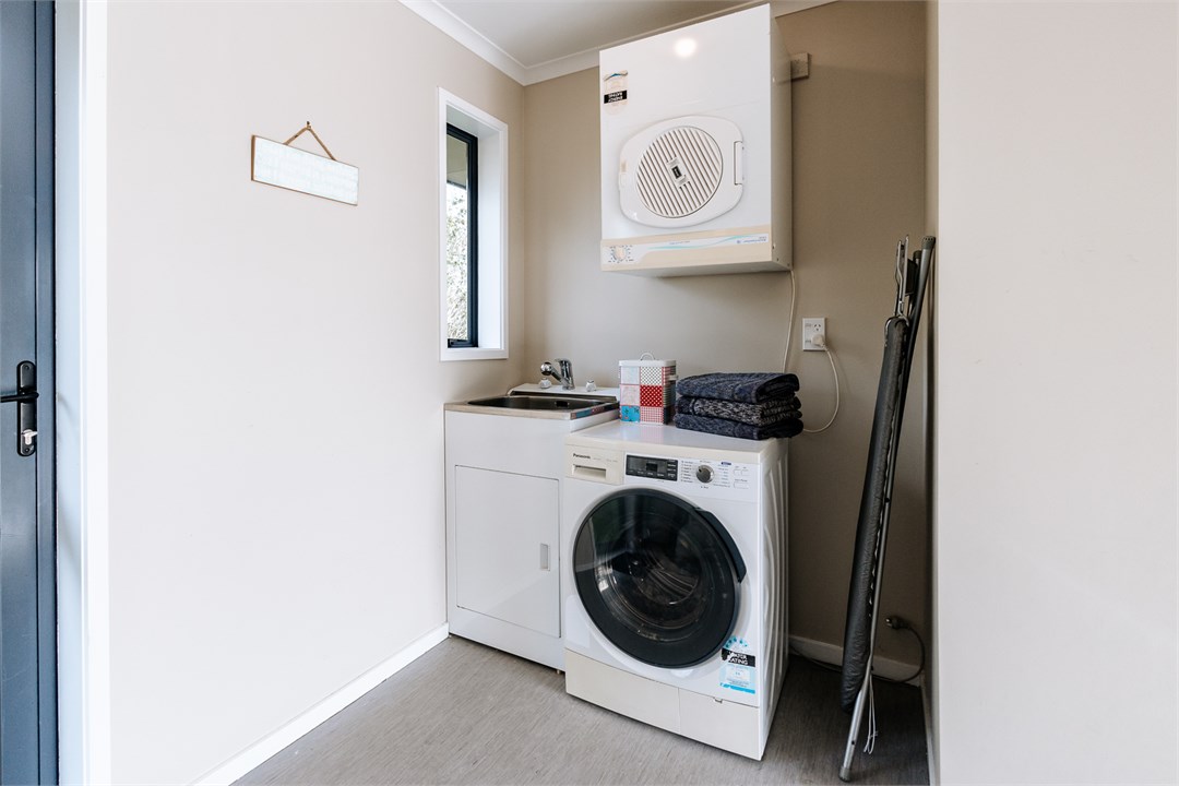 Laundry is inside the integral garage, includes 9k