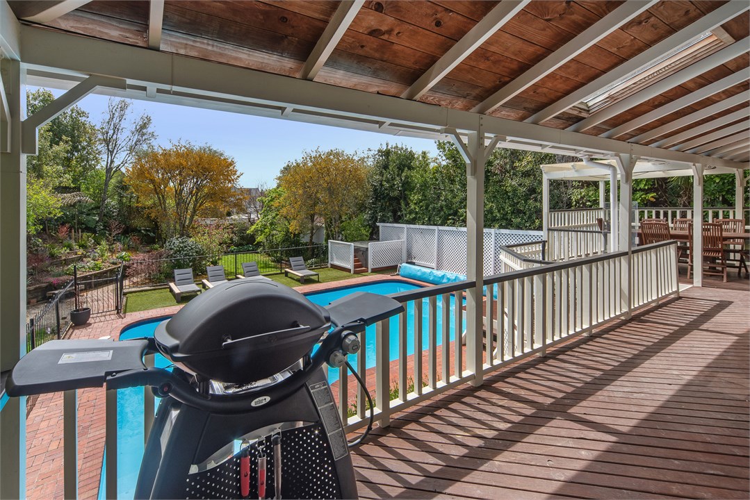 Weber BBQ on covered verandah overlooking pool