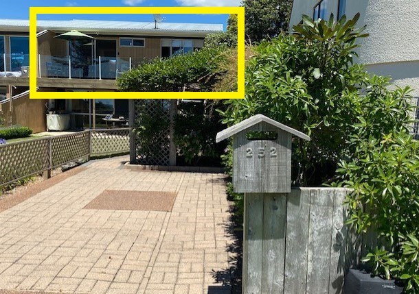 Front view carpark and upstairs unit