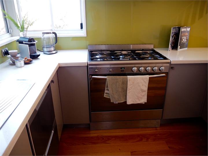 IMG_8136 Kitchen with large stove, microwave, frid