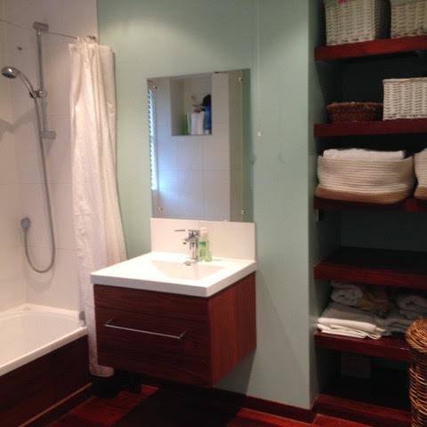 Family bathroom with bath and lots of shelving