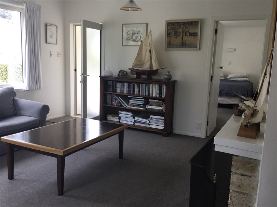 Lounge showing front door on to deck