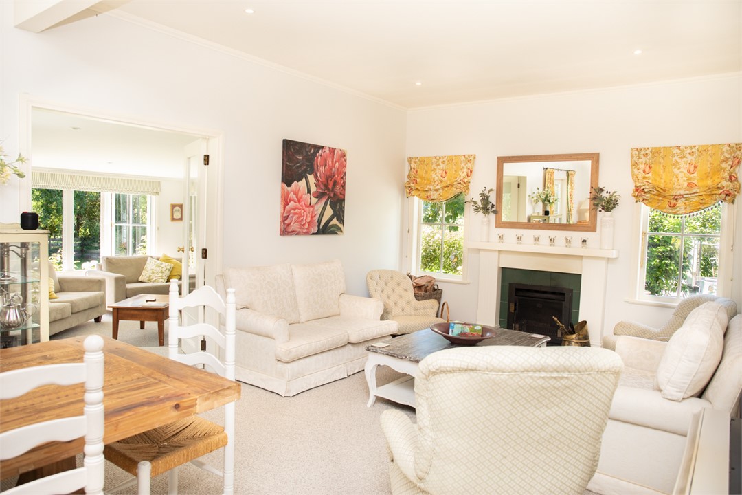 Open plan dinning/lounge area with cozy fire