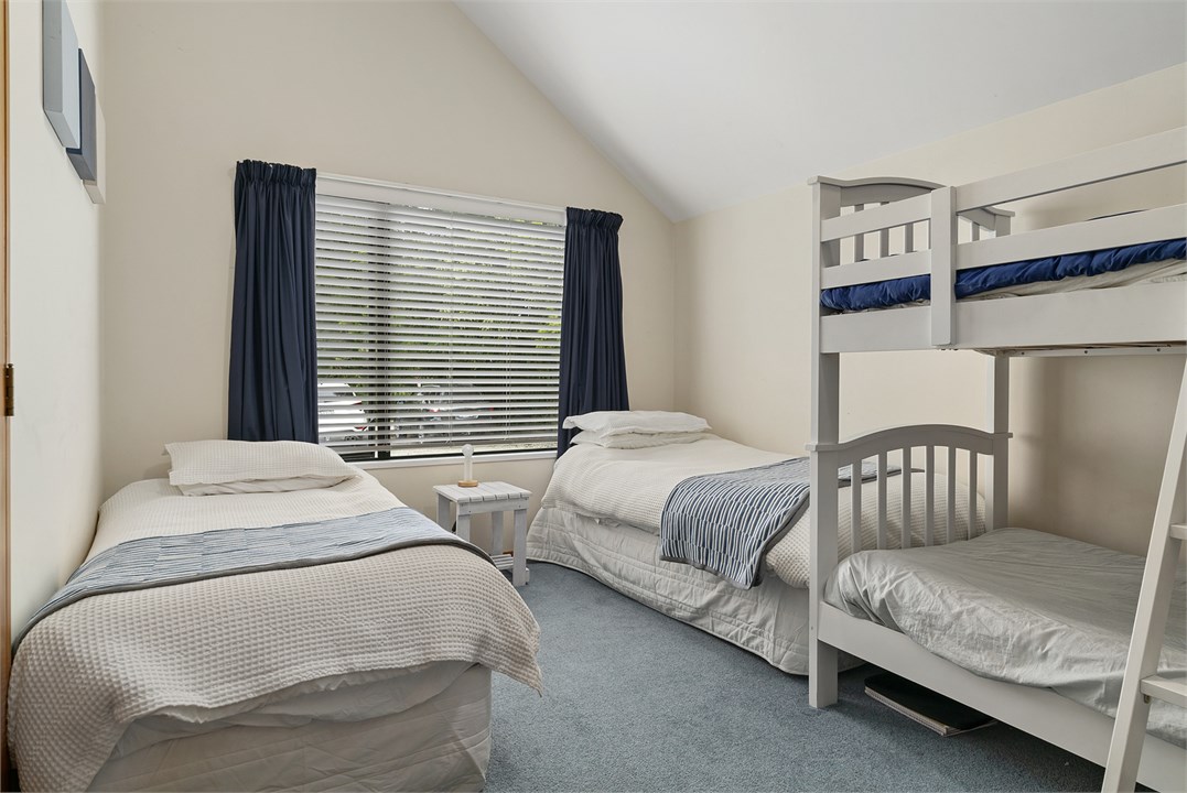 Bedroom 3 has 2 Single beds and a bunk bed