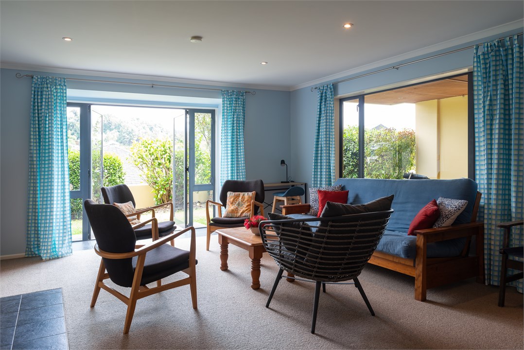 Downstairs studio opens onto a small lawn