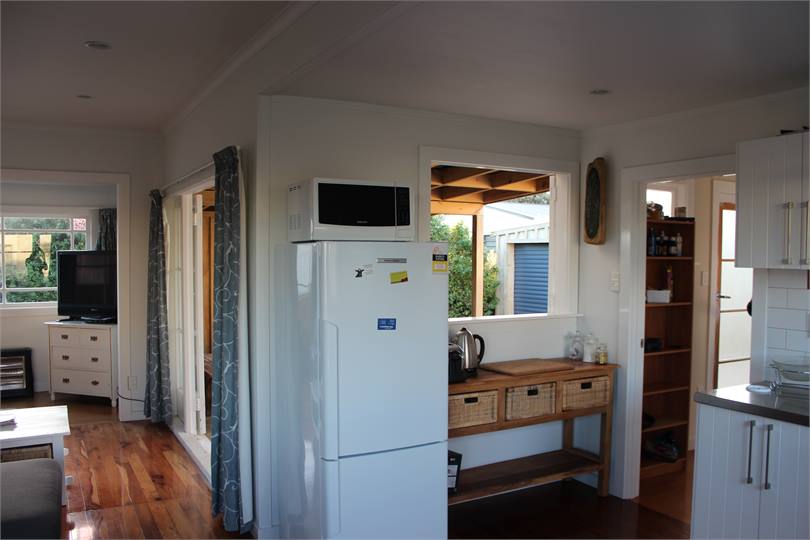 Kitchen, pass through window to back deck.