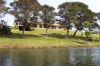 A few steps down the lawn to the river