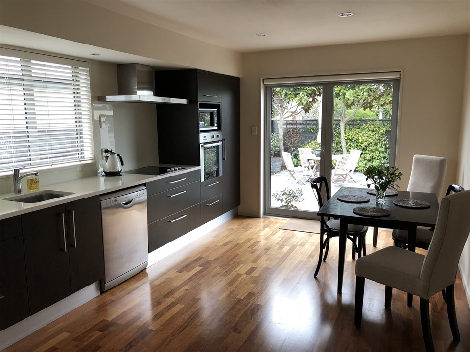 Kitchen Dining area with doors out to courtyard ga