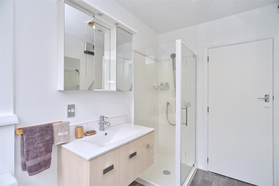 Bathroom has a shower and a toilet