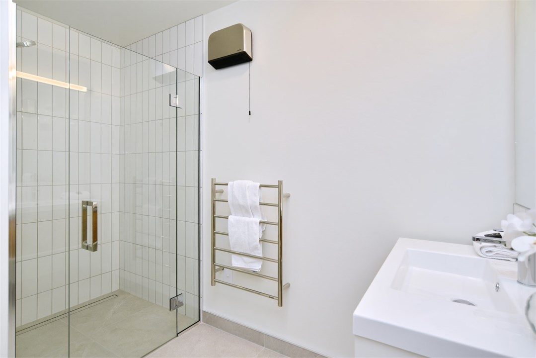 Bathroom has a shower and a toilet