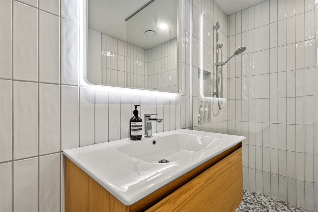 Bathroom has a shower and a toilet