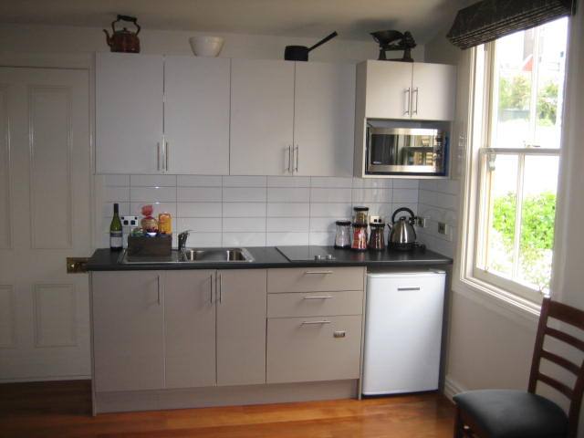 Kitchen with dishwasher and laundry