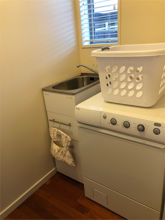 Laundry with Asko front loading washing machine