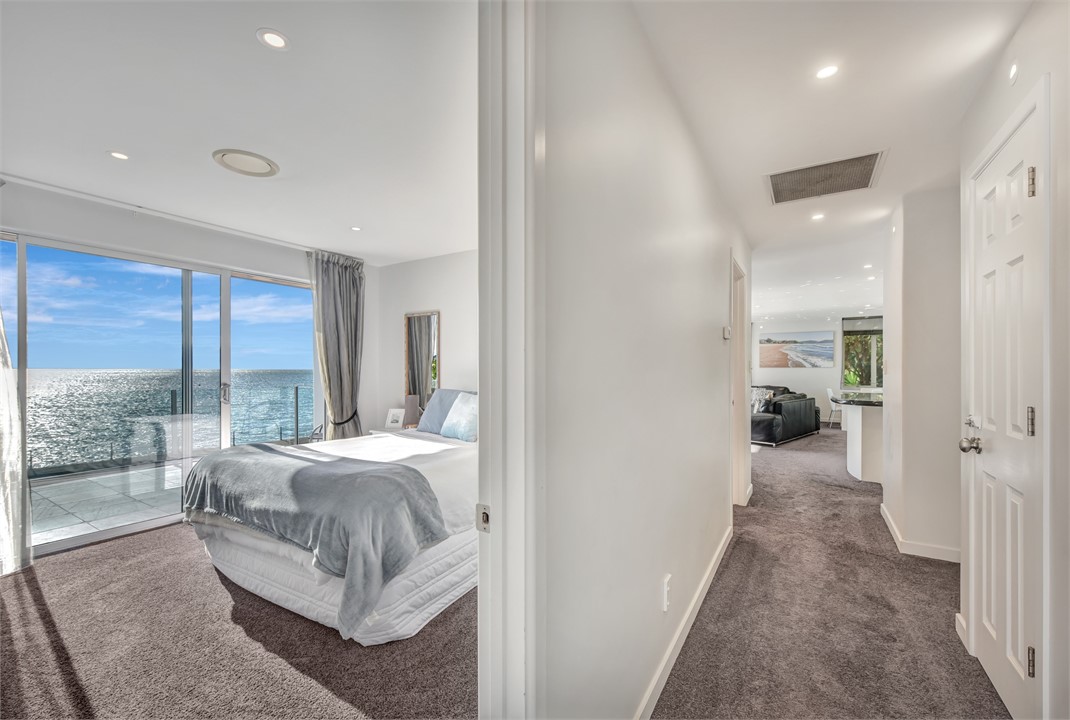 Queen bedroom and hallway looking down into the op