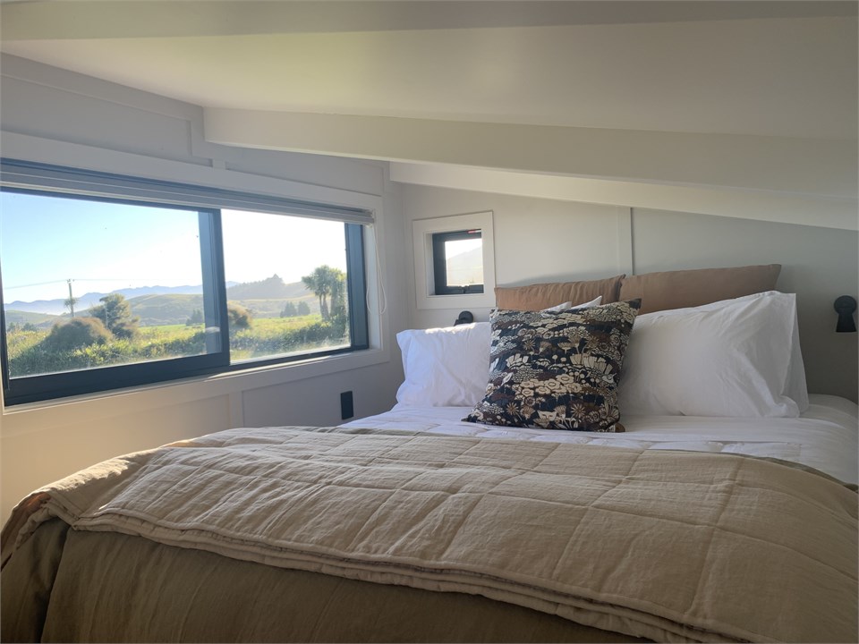 Queen bed looking out to the ocean