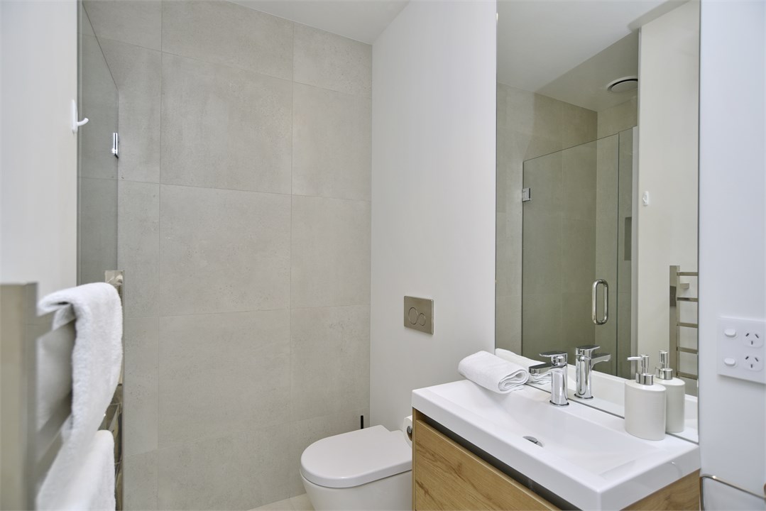 Bathroom 2 has a shower and a toilet