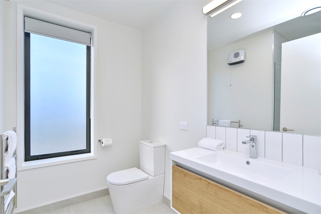 Bathroom 2 has a shower and a toilet