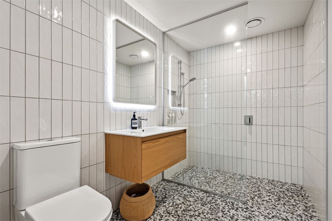 Bathroom has a shower and a toilet