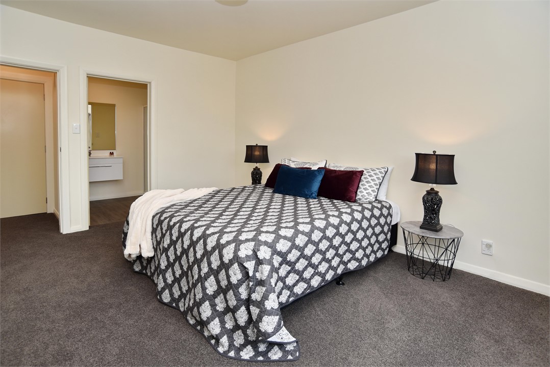 Master bedroom with queen bed and en-suite