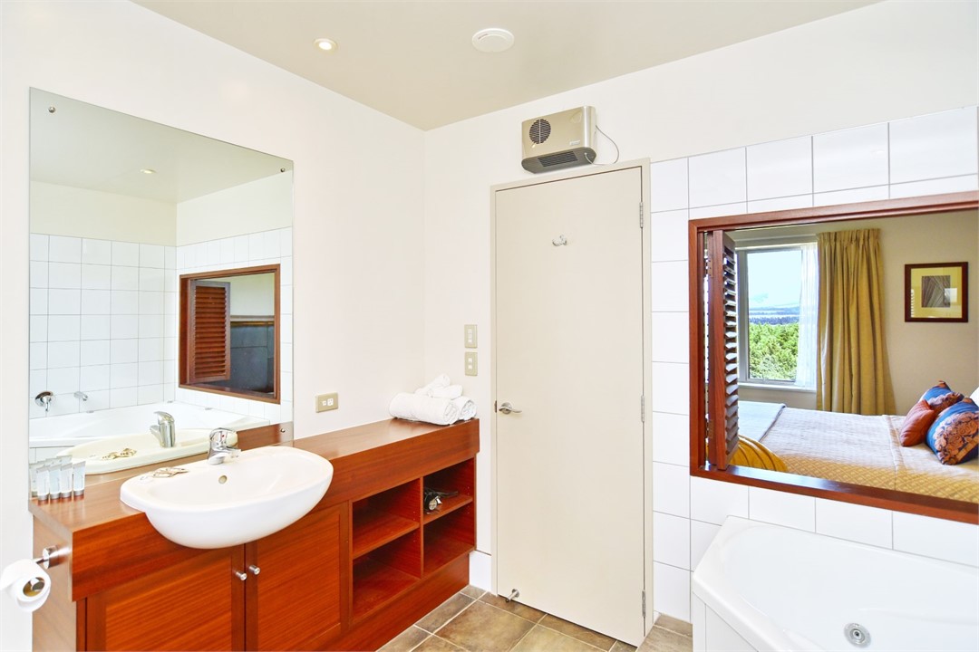 Ensuite to Bedroom 1 with a spa bath and shower