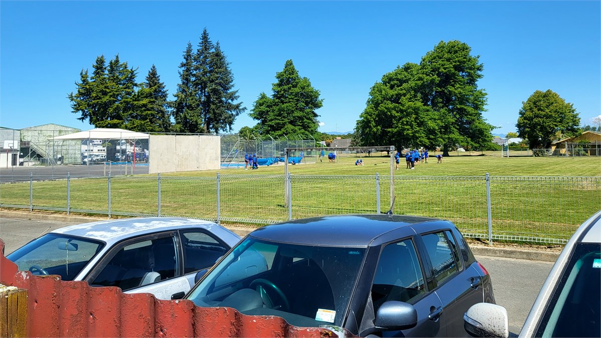 School grounds & pool through the side gate.