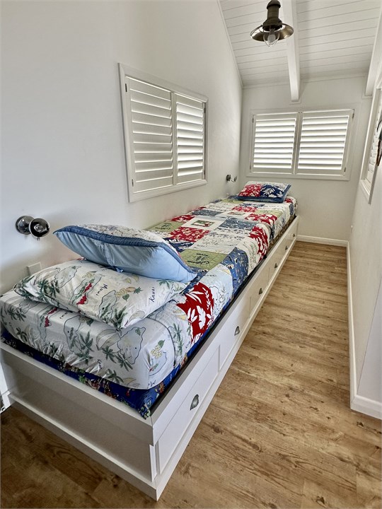 Two of the four single beds upstairs.