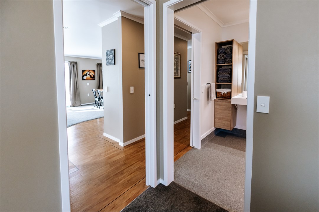 View from main bedroom leading to the bathroom and