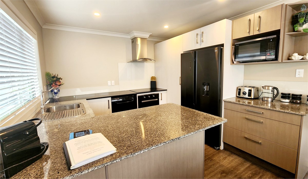 Kitchen with large fridge/freezer and all the mod 