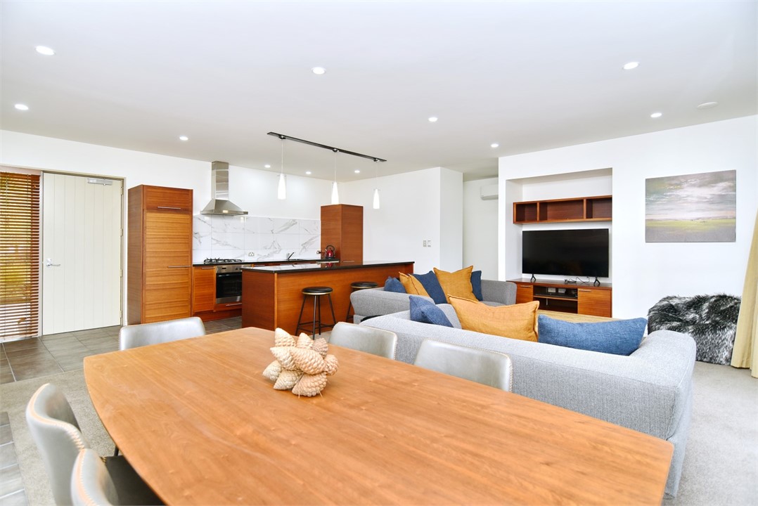 Living area with a TV and the dining area