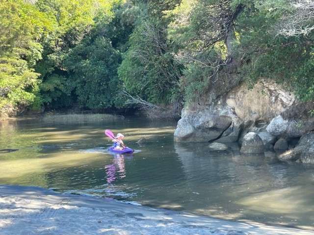 Katie using the kids kayak in Stephens Bay inlet