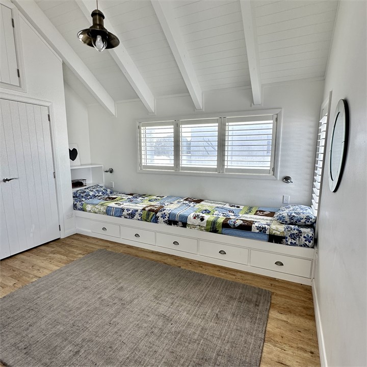 Two of the four single beds upstairs.