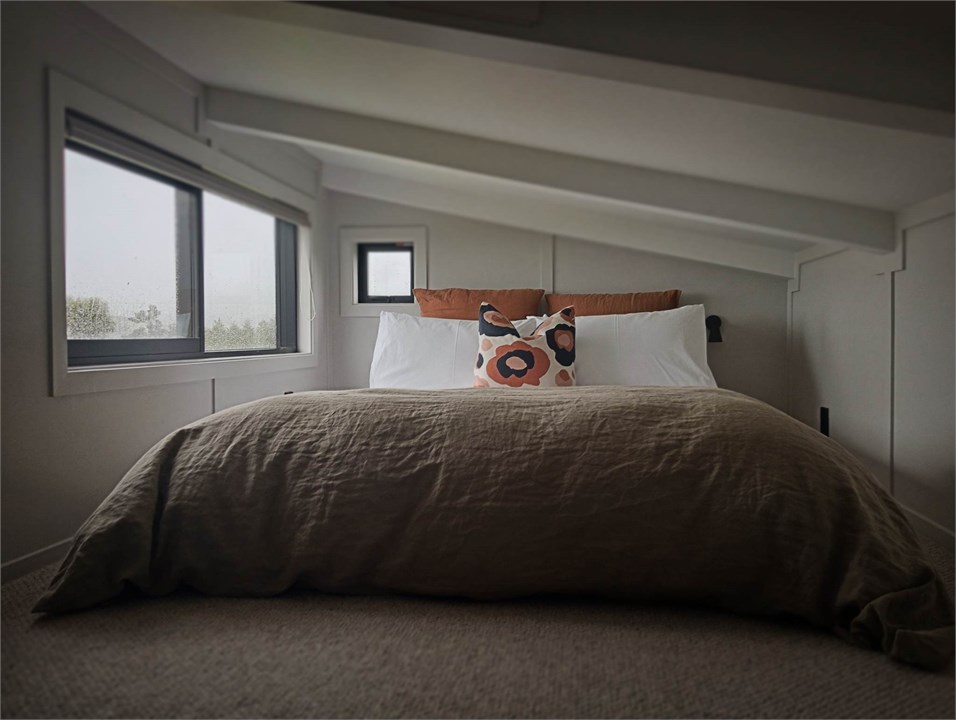 Queen bed on raised mezzanine