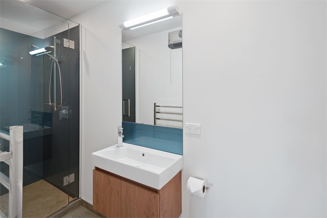 Bathroom 2 has a shower and a toilet