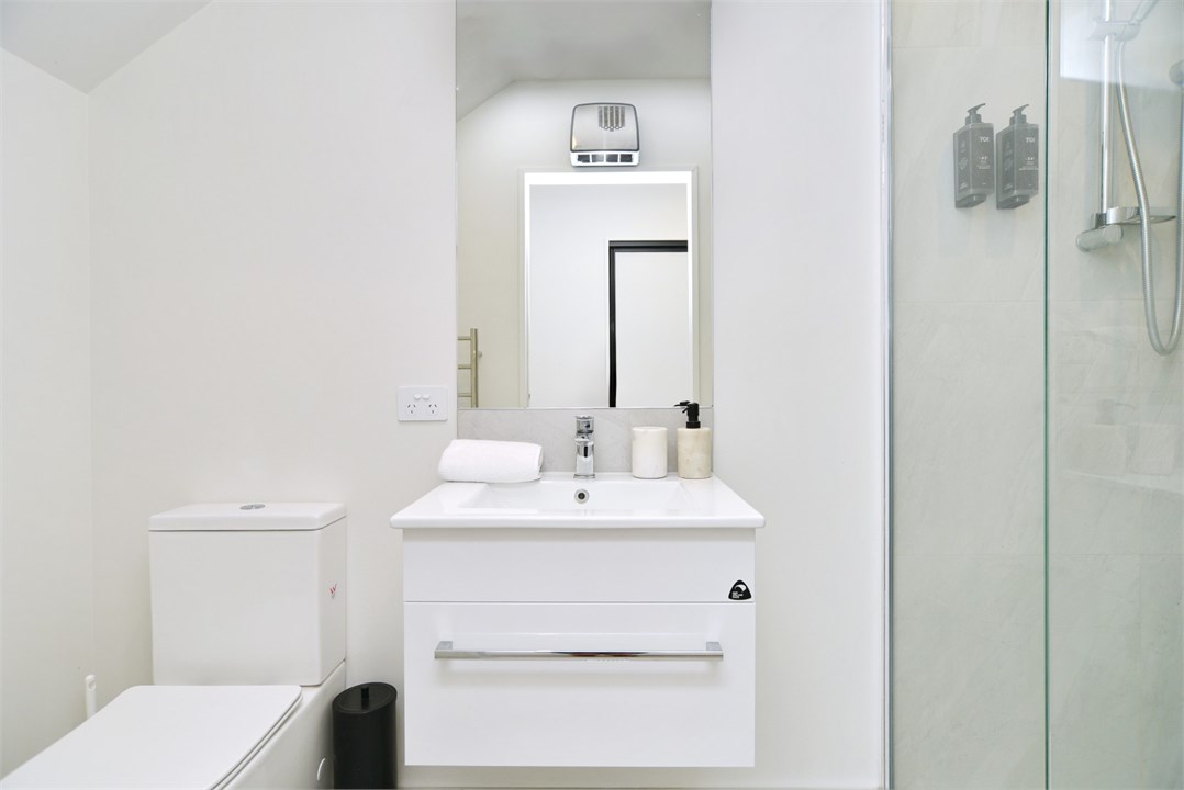 Bathroom 2 has a shower and a toilet