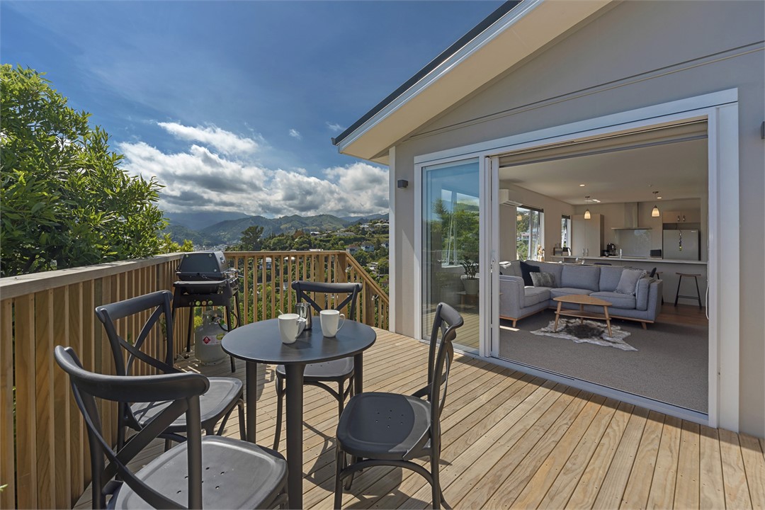 Living area opening on sunny deck