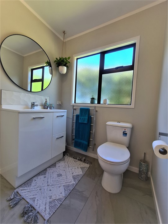 Bathroom includes a toilet and vanity