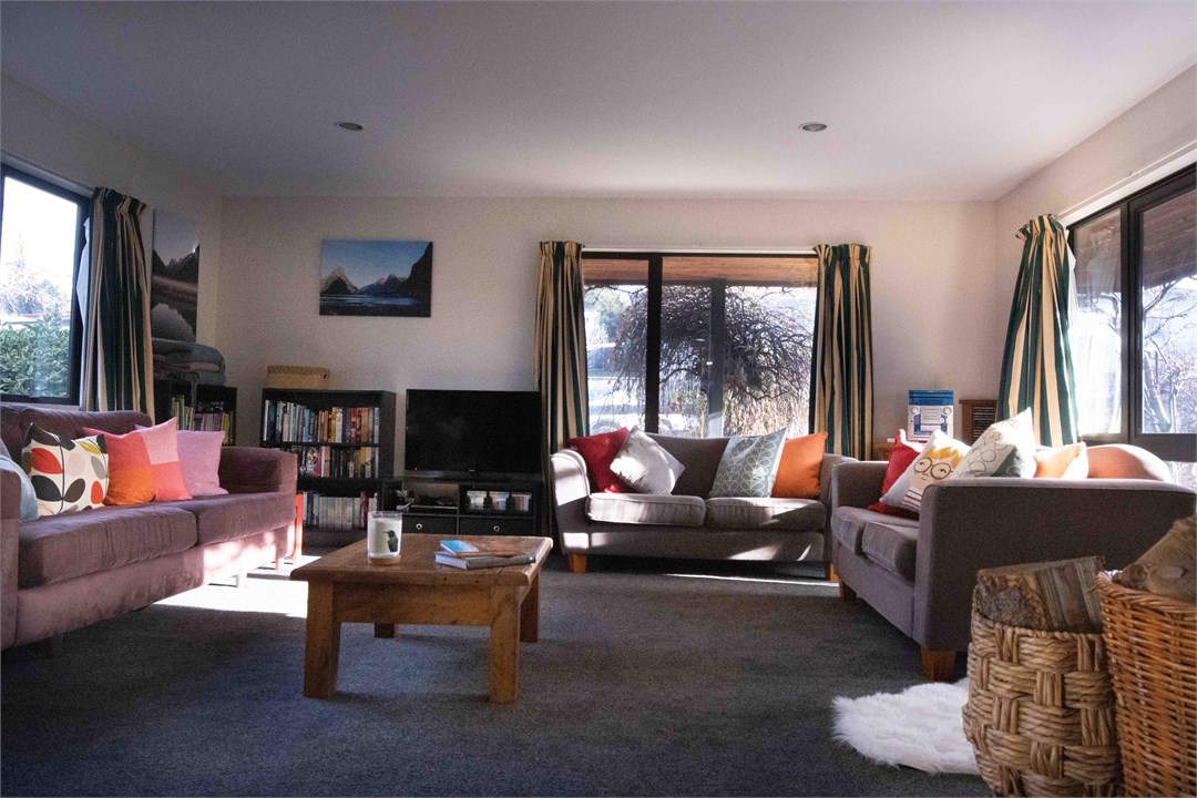 Cozy lounge plenty of seating, wood fire & veranda