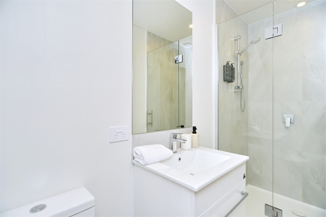 Bathroom 2 has a shower and a toilet