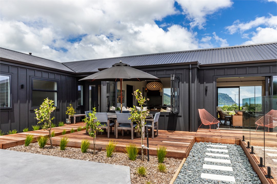 Outdoor Dining with view through to the lake and m