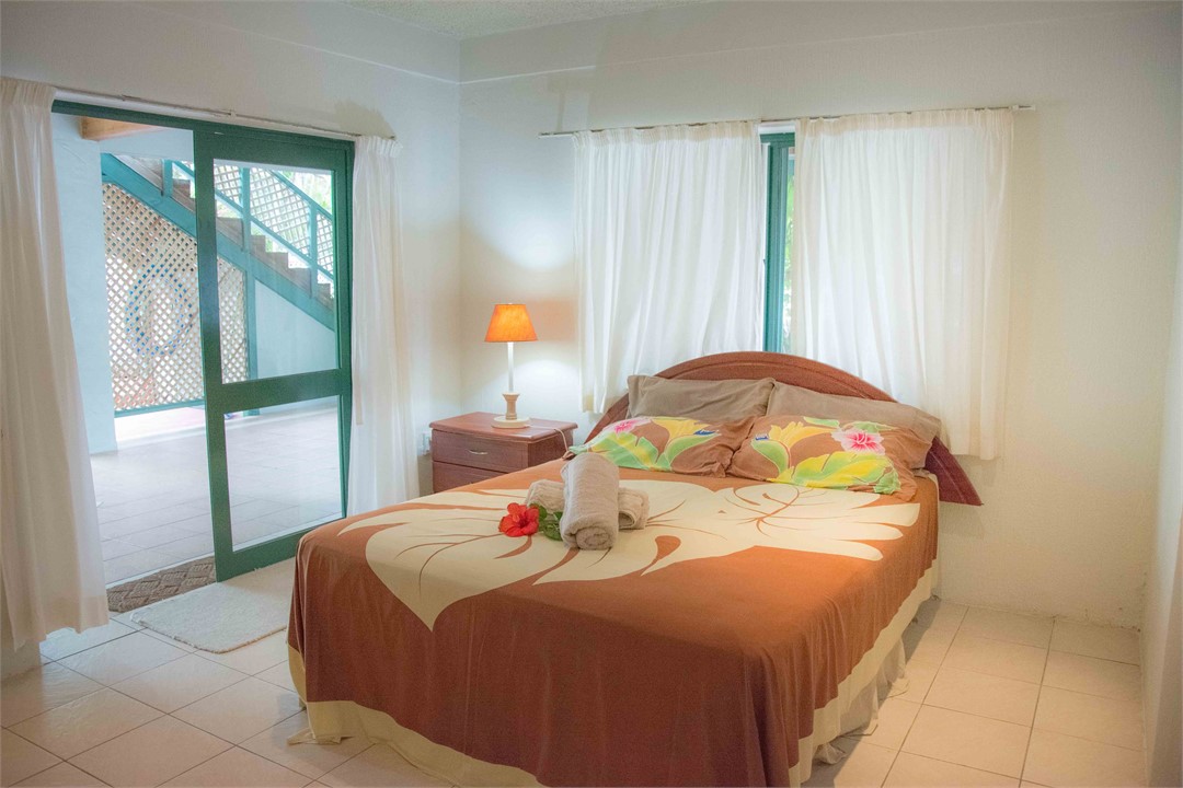 Ground level En-suite Bdrm 1, opens to the pool