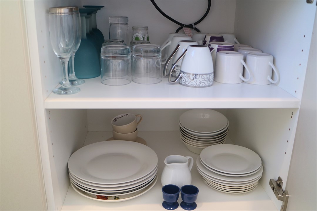 Plenty of cookware, dishes and glassware