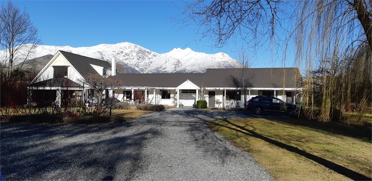 Main house with Remarkables behind in winter
