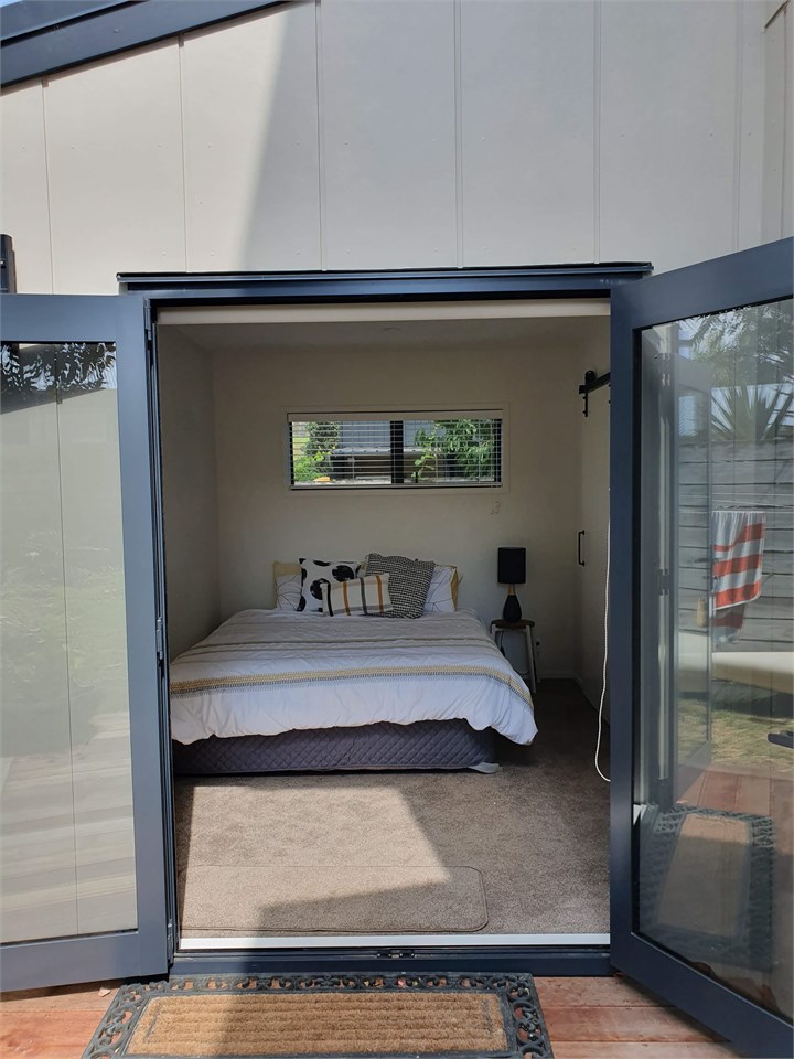 Downstairs bedroom, opens onto back yard.