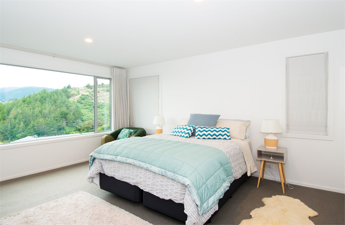 Spacious master bedroom with a king bed
