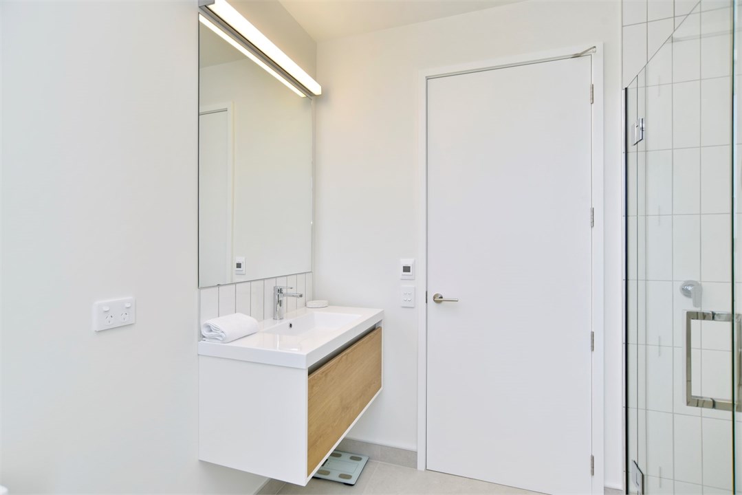 Bathroom 2 has a shower and a toilet