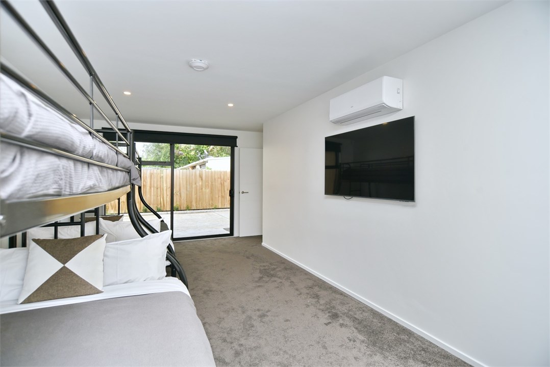 Bedroom 3 has 2 Bunk beds and a TV