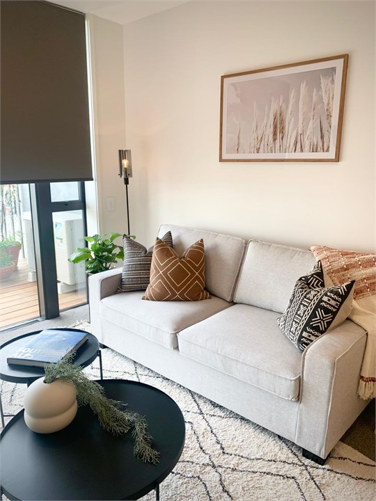 Living room has a TV and seating areas