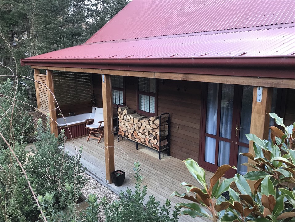 view of bath and wood stack